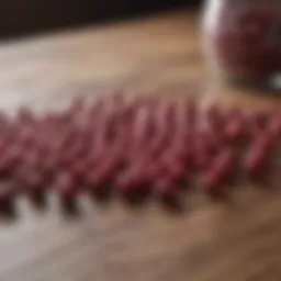 Cranberry pills on a wooden table